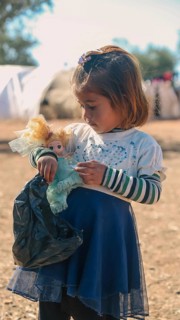 Syrian children playing in a refugee camp near the Turkish border on World Children's Day. Aleppo,