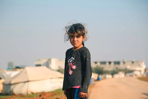 Syrian children living in a temporary refugee camp near the Syrian-Turkish border on World