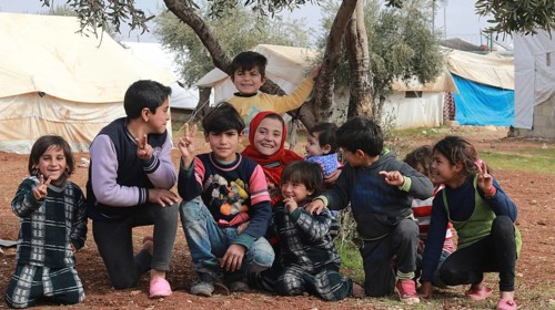 A group of Syrian refugee children gathered inside a camp. Aleppo, Syria July 3, 2015, Aleppo,