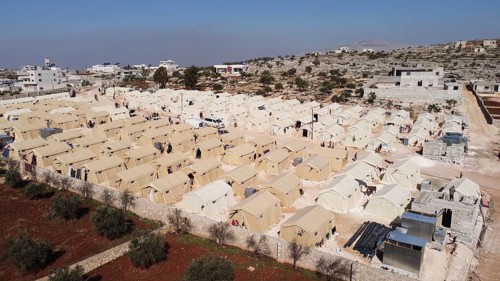 Aerial photo showing dozens of makeshift tents housing Syrian refugees near the Turkish border