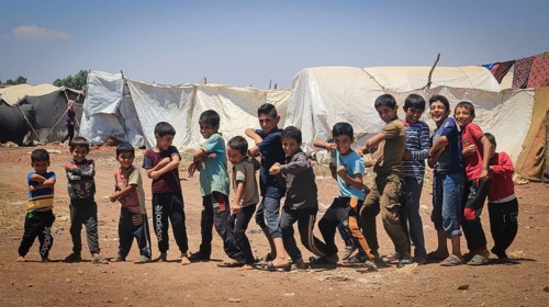 A group of Syrian refugee children gathered inside a camp. Aleppo, Syria February 1, 2015, Aleppo,