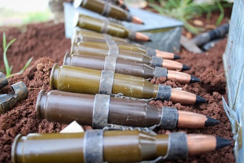 Syrian armed opposition fighters preparing ammunition during combat against ISIS. Aleppo, Syria