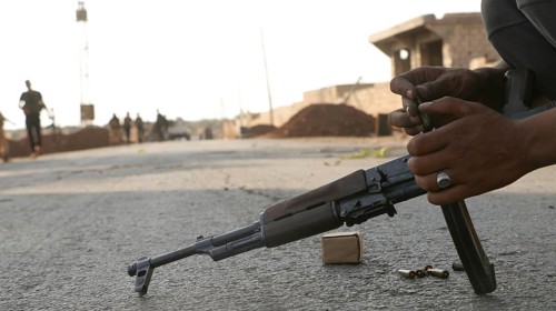 Syrian armed opposition fighters preparing ammunition during combat against ISIS. Aleppo, Syria