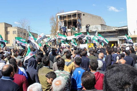 Civilians demonstrating in support of the Syrian revolution against the Bashar al-Assad regime.
