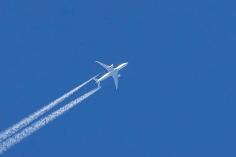 Boeing 787 Dreamliner jet passenger aircraft of KLM Royal Dutch airlines with a vapour trail or