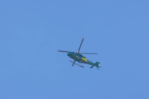 Agusta AW119 Koala Mk.II helicopter flying in a blue sky, England, United Kingdom