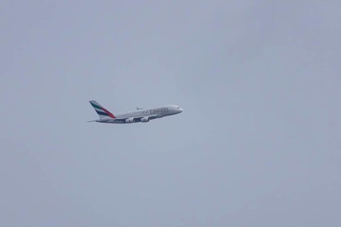 Airbus A380 jet passenger aircraft of Emirates airlines flying, England, United Kingdom