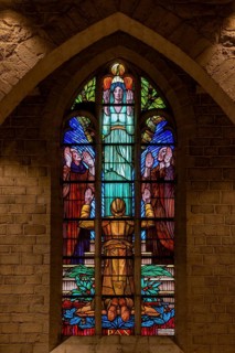Stained glass window showing WWI Belgian soldier at World War One necropolis in the St Peter's
