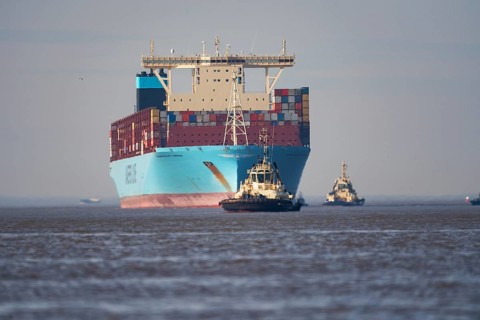 Container ship with pilot vessels near Bremerhaven, Lower Saxony