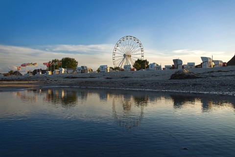 Ferris wheel and beach chairs on the beach at Dahme, Bay of Lübeck, Baltic Sea, Schleswig-Holstein