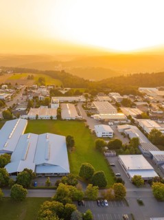 Industrial area with many buildings in a picturesque landscape at sunset, industrial area Wolfsberg
