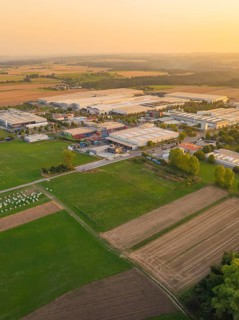 Industrial area with surrounding fields at sunset, industrial area Wolfsberg Nagold, district Calw,