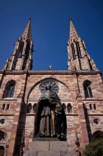 Monument, statue of Charles Emile Freppel, theologian and Bishop of Angers, in front of the church