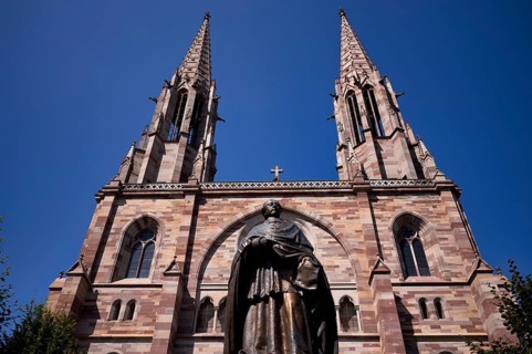 Monument, statue of Charles Emile Freppel, theologian and Bishop of Angers, in front of the church