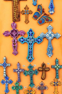 Orthodox crosses in different colours, typical souvenir shop in the old town, Oia, Thira,