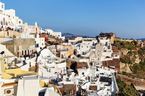 Tourists, crowd waiting for sunset in narrow alleys, Agios Nikolaos Castle, Oia, Thira, Santorini,