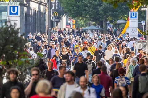 Crowd on the way in the shopping street. Königstraße pedestrian zone in Stuttgart,