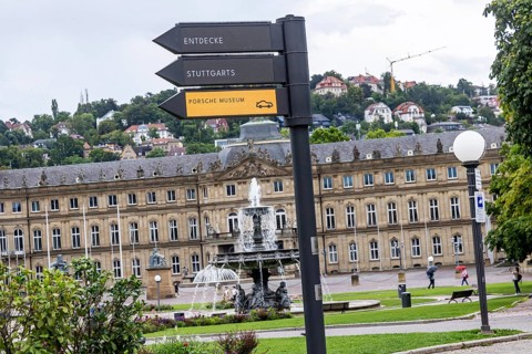 Digital signpost in front of the New Palace on Schlossplatz in Stuttgart. Regularly changing LED