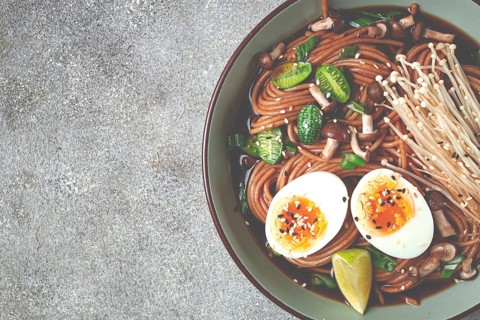 Soba, buckwheat noodles, with enoki mushrooms, shimeji and boiled egg, top view, homemade, no