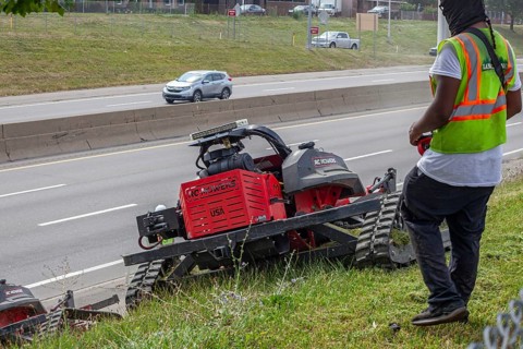 Harper Woods, Michigan, Remote-control mowers are cutting the grass and weeds along Interstate 94