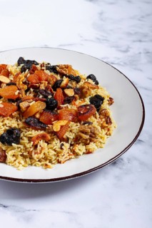 Rice dish, with the addition of dried fruits, nuts and spices of Middle Eastern cuisine, homemade,
