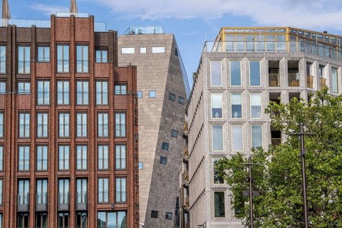 The Grote Markt in the old town of Groningen, modern facades of hotel and commercial buildings, in