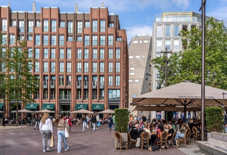 The Grote Markt in the old town of Groningen, modern facades of hotel and commercial buildings, in