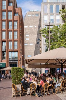 The Grote Markt in the old town of Groningen, modern facades of hotel and commercial buildings, in