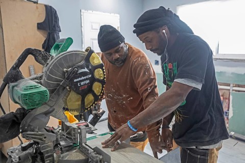 Detroit, Michigan - Workers remodel a house in the Morningside neighborhood that had been vacant