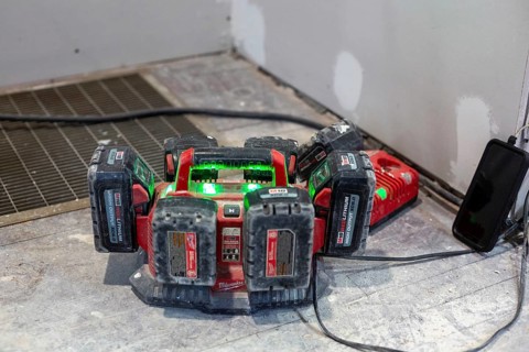 Detroit, Michigan - Batteries for power tools recharge as workers remodel a house in the