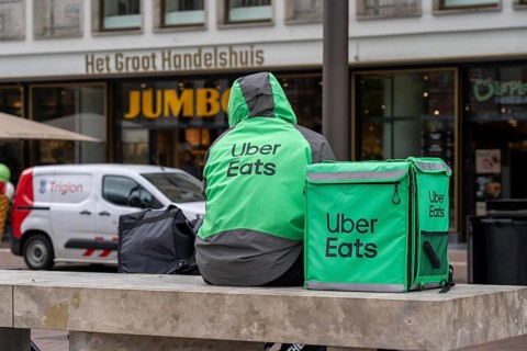 Bicycle transport in Groningen, Uber Eats, courier driver waiting for new orders, Netherlands
