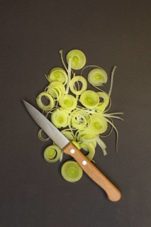 Leeks, leek rings with kitchen knife, sliced leek stalk, leek