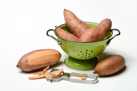 Sweet potato with potato peeler, Ipomoea batatas