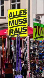 Retail trade with signs for price reductions and discounts, Potsdam, Brandenburg, Germany