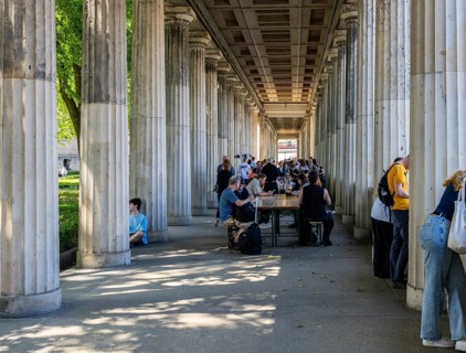 Tourists and passers-by in the colonnade courtyard of the Neues Museum, Bodestraße in Berlin Mitte,