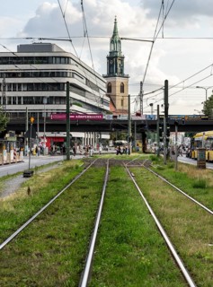Tram bed at Alexanderplatz with St. Mary's Church in the background, Berlin, Germany