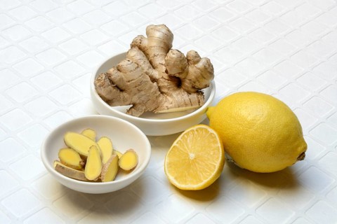 Ginger, ginger tubers and ginger slices in peel, lemon