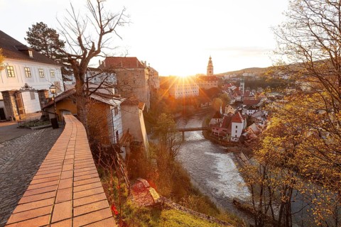 Spring morning sunrise with castle view over the rooftops of Krumlov in southern Bohemia, Czech