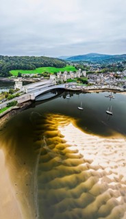 Conwy Castle over River Convy from a drone, Convy, North Wales, England, United Kingdom