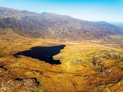 Autumn colours over Llyn Cwmffynnon and Miner's Track, Start Point, road A4086 from a drone,