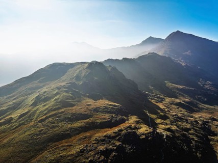 DefaultAutumn colours of Pen-y-Pass over Miner's Track, Start Point and road A4086 from a drone,
