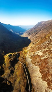 Autumn colours of Pen-y-Pass over Miner's Track, Start Point and road A4086 from a drone,