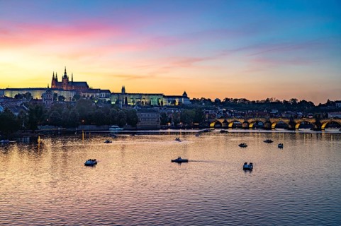 Sunset over the Vltava River, Charles Bridge and Prague Castle in Prague, Czech Republic
