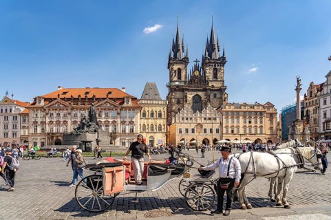 Horse-drawn carriage and Tyn church on Old Town Square in the Old Town of Prague, Prague, Czech