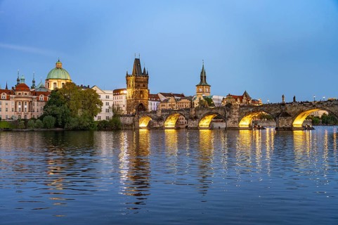 Old Town of Prague with Vltava River, Charles Bridge and Old Town Bridge Tower at dusk, Prague,