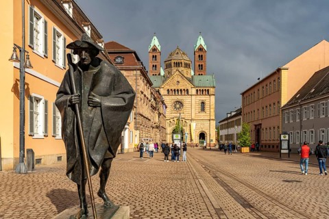 Sculpture of a Saint James Pilgrim on Maximilianstraße and Speyer Cathedral in Speyer,