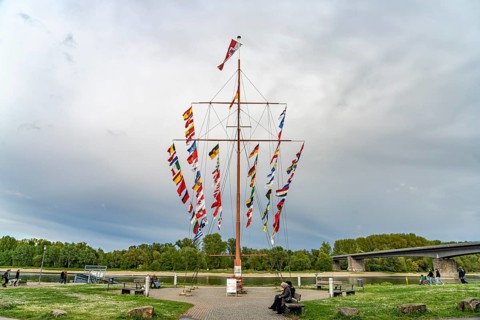 Flag pole on the Helmut-Kohl-Ufer Rhine promenade in Speyer, Rhineland-Palatinate, Germany
