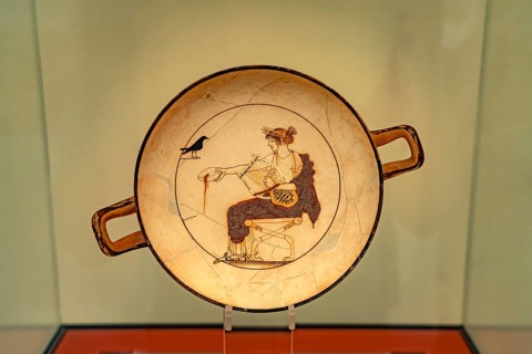 Plate Apollo and the Raven in the Archaeological Museum of Delphi, UNESCO World Heritage Site in