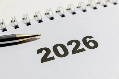Ringbook calendar, calendar sheet for the year 2026 with a black pen next to it