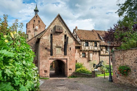 The entrance portal on the city wall of the historic town of Riquewihr, Ellsass